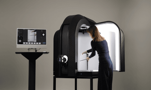 Woman using Alphashot XL G2 photography station